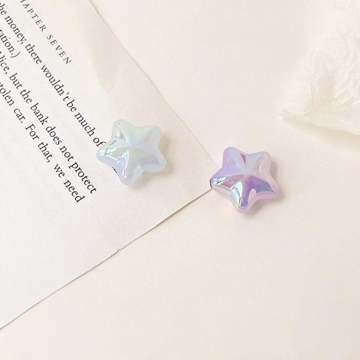Blue and purple acrylic star beads with a glossy iridescent finish.