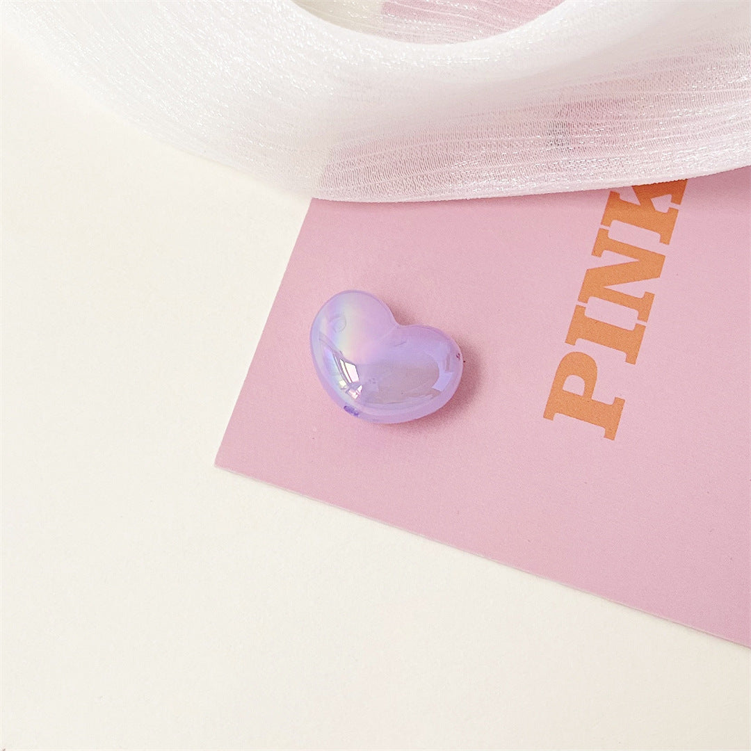 Purple jelly heart acrylic bead with a glossy iridescent surface.