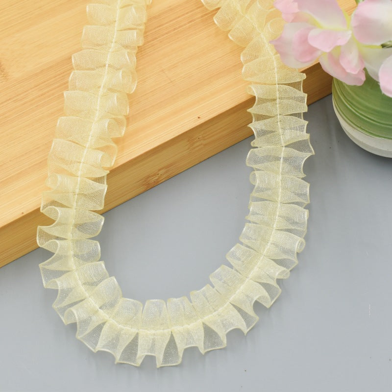 Yellow sheer ruffled lace trim, 2.5 cm wide.