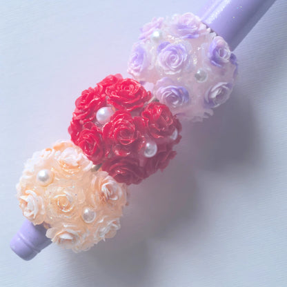 Three rose flower ball beads on a purple beadable pen; the pen is a display example and is not included.