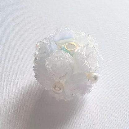 Translucent light blue rose flower ball bead with pale blue rose petals, pearl-like accents and a threading hole.