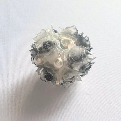 Black rose flower ball bead with dark rose petals, pearl-like accents and a threading hole.