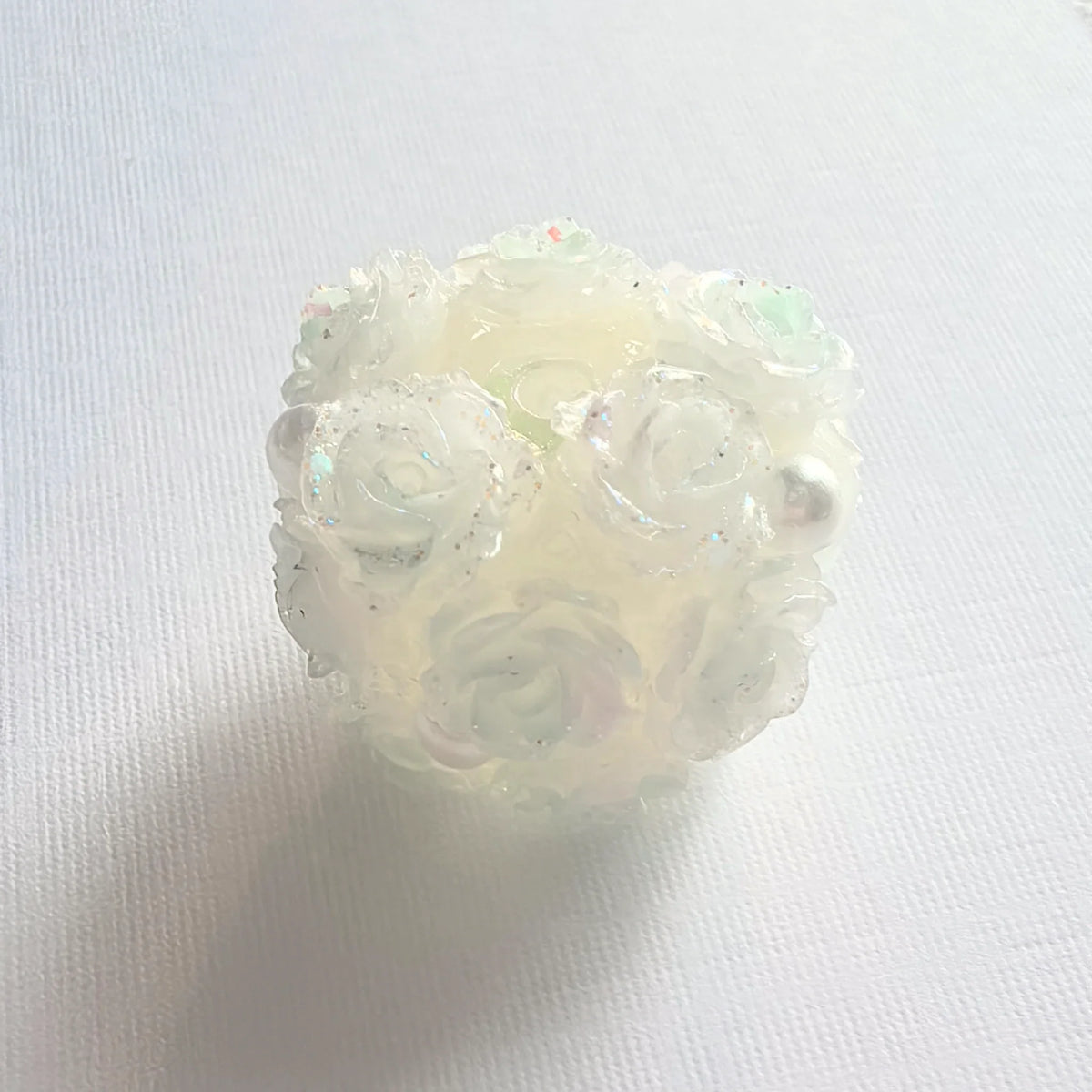 Pale green rose flower ball bead with translucent rose petals, pearl-like accents and a threading hole.