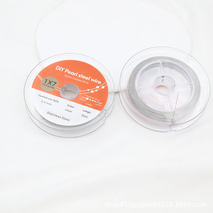 Steel-colored nylon-coated beading wire on clear spools; metallic steel appearance.