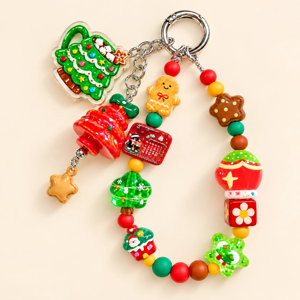 Complete Christmas beaded phone charm with gingerbread, Christmas tree and star details and a silver-tone ring clasp.