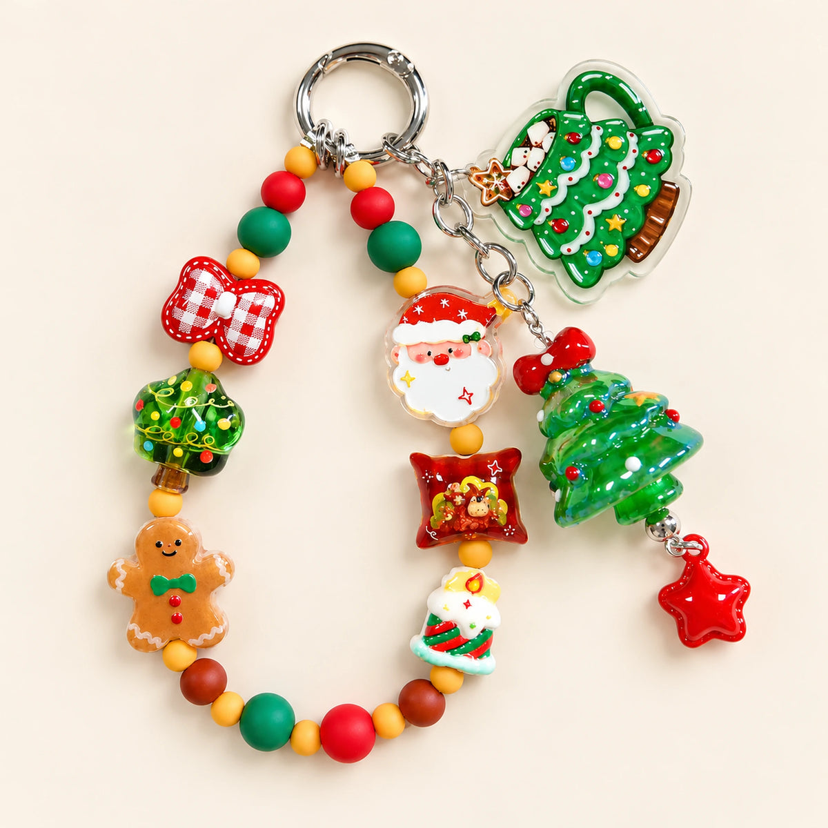 Complete Christmas beaded phone charm with Santa, a red gingham bow, gingerbread, green Christmas trees and a silver-tone round spring clip.