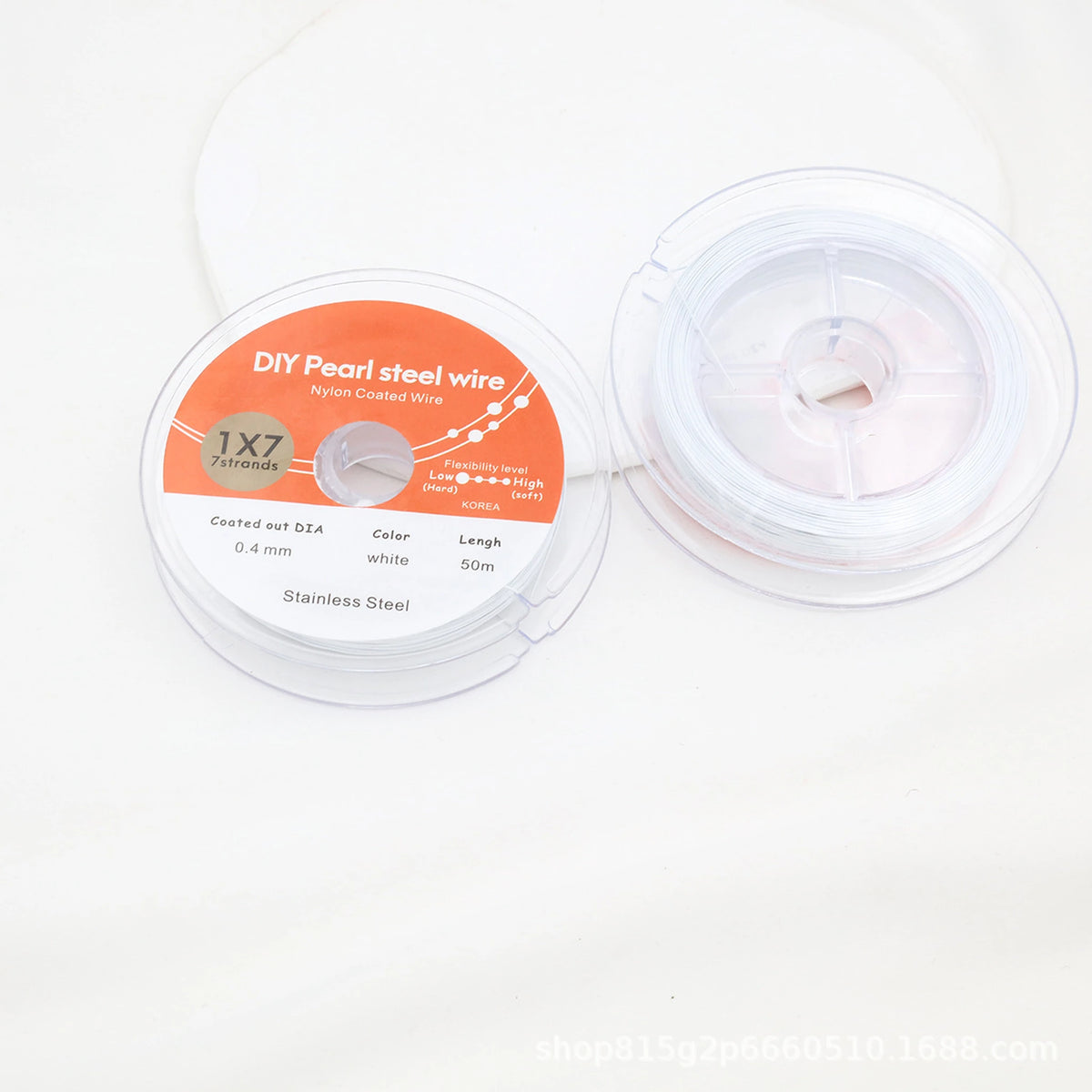 White nylon-coated beading wire shown from both sides in clear spool packaging.