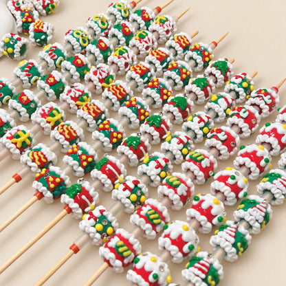 Close up of assorted glossy Christmas 3D decorative beads threaded on rods