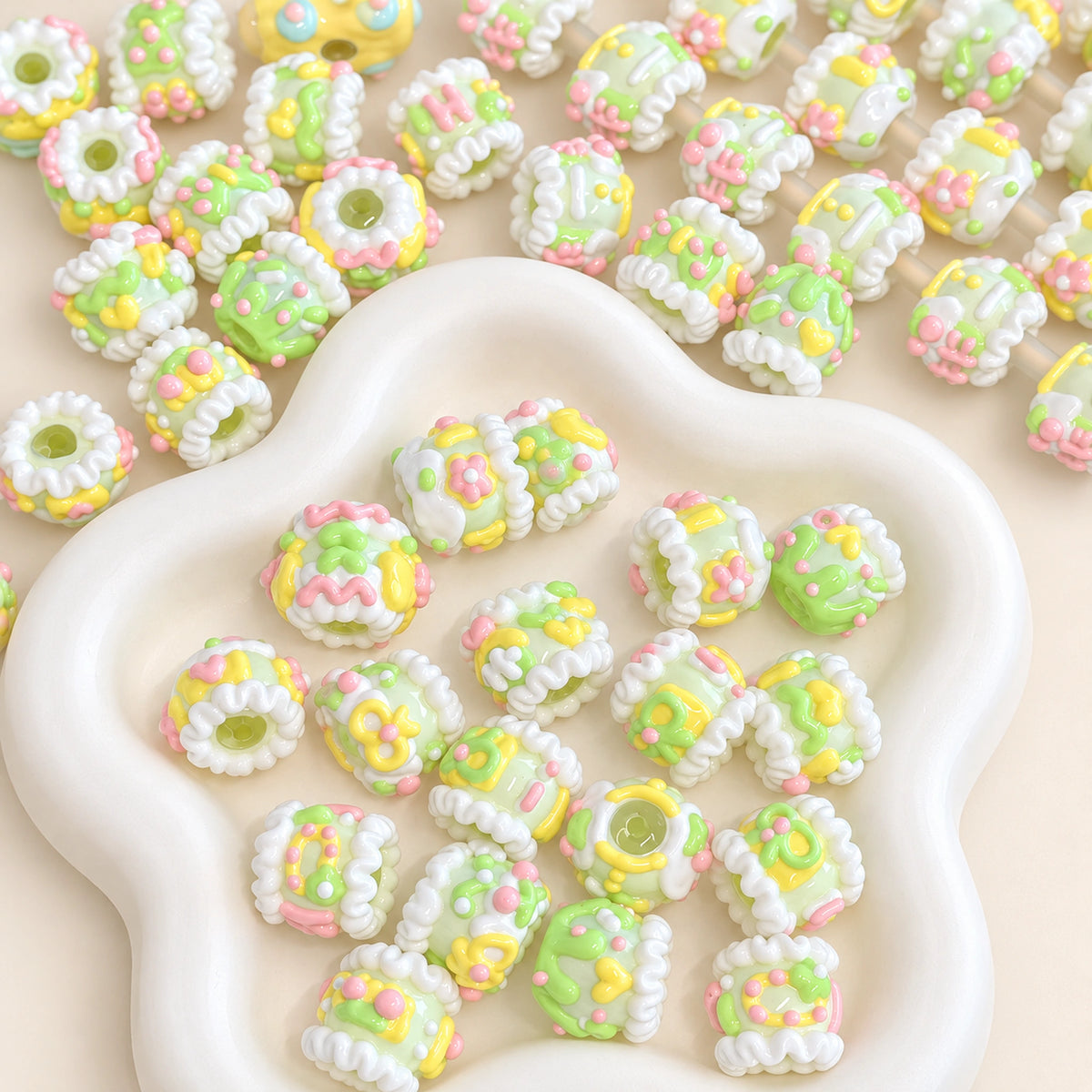 Spring Meadow yellow and green 3D hand-painted decorative beads in a cream petal dish